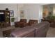 Spacious living area with cozy seating, wooden accents, and plenty of room for entertaining at 7515 Splashing Rock Dr, Las Vegas, NV 89131