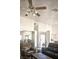 Bright living room with neutral walls, vaulted ceilings, and comfortable leather furniture at 7515 Splashing Rock Dr, Las Vegas, NV 89131