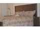 Bedroom detail showcasing a bed frame with decorative pillows and a cute dog at 7515 Splashing Rock Dr, Las Vegas, NV 89131