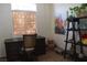 Cozy home office featuring a dark wood desk, shelving, and decorative accents at 7515 Splashing Rock Dr, Las Vegas, NV 89131