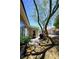 The back yard has desert landscaping and an enclosed sun room at 7727 Widewing Dr, North Las Vegas, NV 89084