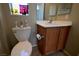 Bright bathroom showcasing a vanity with traditional wood cabinetry at 7727 Widewing Dr, North Las Vegas, NV 89084