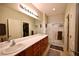 Bathroom featuring double sinks and a view into a walk-in closet at 7727 Widewing Dr, North Las Vegas, NV 89084