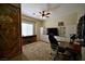 Shows a bedroom with cabinets, a desk, and natural light at 7727 Widewing Dr, North Las Vegas, NV 89084