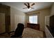 The bedroom has a ceiling fan and good natural light from the window at 7727 Widewing Dr, North Las Vegas, NV 89084