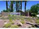 Sun City Aliante community entrance featuring mature landscaping and desert flora at 7727 Widewing Dr, North Las Vegas, NV 89084