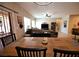Light-filled dining room featuring an wood table, views to the living area, and access to the outdoor space at 7727 Widewing Dr, North Las Vegas, NV 89084