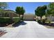 Charming home with a well-manicured lawn and a two-car garage at 7727 Widewing Dr, North Las Vegas, NV 89084