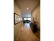 Inviting hallway with tile flooring leading to a spacious living area at 7727 Widewing Dr, North Las Vegas, NV 89084