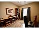Home office featuring book shelves, neutral wall color, and a ceiling fan at 7727 Widewing Dr, North Las Vegas, NV 89084