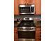 Kitchen with stainless steel oven range, granite countertops, and ample storage at 7727 Widewing Dr, North Las Vegas, NV 89084