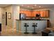 Modern kitchen with stainless steel appliances, ample counter space, and seamless flow to dining area at 7727 Widewing Dr, North Las Vegas, NV 89084