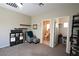 Well-organized living space adjacent to a neat, tiled bathroom at 7727 Widewing Dr, North Las Vegas, NV 89084
