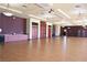 Spacious meeting room with hardwood floors, recessed lighting, and ample storage, ready for events and gatherings at 7727 Widewing Dr, North Las Vegas, NV 89084