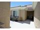 Cozy outdoor patio with seating and a tranquil ambiance at 7727 Widewing Dr, North Las Vegas, NV 89084