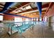 Indoor pool with blue trim and skylights and plenty of light at 7727 Widewing Dr, North Las Vegas, NV 89084