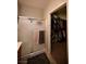 Glass-enclosed shower is shown leading into a walk-in closet at 7727 Widewing Dr, North Las Vegas, NV 89084