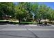 Serene street view with mature trees in a well-maintained neighborhood at 7727 Widewing Dr, North Las Vegas, NV 89084