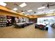 Large studio space filled with long tables, chairs, and shelving, ideal for a variety of projects and creative activities at 7727 Widewing Dr, North Las Vegas, NV 89084
