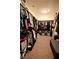 Spacious walk-in closet with ample storage and carpeted flooring at 7727 Widewing Dr, North Las Vegas, NV 89084