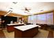 Bright work room featuring worktops, cabinets, counter space, and natural light for creative projects at 7727 Widewing Dr, North Las Vegas, NV 89084