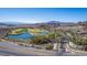 Expansive aerial view of the Lake Las Vegas community showcasing the lush landscaping and stunning mountain backdrop at 8 Via Tiberina, Las Vegas, NV 89011