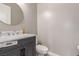 Elegant half bathroom with a marble countertop and a dark gray vanity at 8 Via Tiberina, Las Vegas, NV 89011