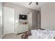 Bedroom featuring a white dresser with a TV, carpet, ceiling fan and neutral paint at 8 Via Tiberina, Las Vegas, NV 89011