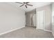 Empty bedroom with neutral paint, carpet, ceiling fan, bright light and access to bathroom at 8 Via Tiberina, Las Vegas, NV 89011