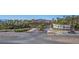 Entrance to Lake Las Vegas featuring lush landscaping, palm trees, and signage welcoming visitors at 8 Via Tiberina, Las Vegas, NV 89011