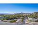 Scenic entrance to Lake Las Vegas featuring lush landscaping, palm trees, and a picturesque bridge at 8 Via Tiberina, Las Vegas, NV 89011