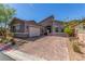Beautiful exterior of a modern home with a three-car garage and paved driveway at 8 Via Tiberina, Las Vegas, NV 89011