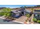 Charming single-story home featuring a gray exterior, a two-car garage, and a well manicured front yard at 8 Via Tiberina, Las Vegas, NV 89011