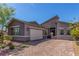 Beautiful exterior of a modern home with a three-car garage and paved driveway at 8 Via Tiberina, Las Vegas, NV 89011
