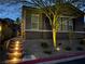Charming home exterior with illuminated entryway and xeriscaped front yard at 8 Via Tiberina, Las Vegas, NV 89011