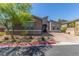 Charming single-story home featuring manicured landscaping, mature trees, and a brick driveway at 8 Via Tiberina, Las Vegas, NV 89011