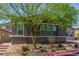 Charming single-story home featuring manicured landscaping, mature trees, and a brick driveway at 8 Via Tiberina, Las Vegas, NV 89011