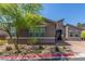Charming single-story home featuring manicured landscaping, mature trees, and a brick driveway at 8 Via Tiberina, Las Vegas, NV 89011