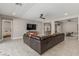Spacious living room with tile floors, media center, and a glimpse into the bedroom at 8 Via Tiberina, Las Vegas, NV 89011