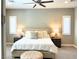 Comfortable main bedroom with neutral tones, ceiling fan, and matching nightstands at 8 Via Tiberina, Las Vegas, NV 89011