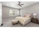 Bright main bedroom with a ceiling fan, bedside table, window with plantation shutters, and a comfortable bed at 8 Via Tiberina, Las Vegas, NV 89011
