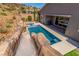 A luxurious pool features a rock waterfall slide and a built in spa, perfect for outdoor entertainment at 8 Via Tiberina, Las Vegas, NV 89011