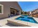 Backyard pool featuring a built-in spa and a rock waterfall slide perfect for enjoying outdoor living at 8 Via Tiberina, Las Vegas, NV 89011