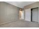 Empty bedroom features carpet floors, base molding, neutral color walls, recessed lights, and a closet at 8486 Insignia Ave # 101, Las Vegas, NV 89178