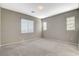 Empty bedroom features carpet floors, base molding, neutral color walls, recessed lights, and a window with blinds at 8486 Insignia Ave # 101, Las Vegas, NV 89178