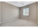 Empty bedroom features carpet floors, base molding, neutral color walls, recessed lights, and a window with blinds at 8486 Insignia Ave # 101, Las Vegas, NV 89178