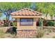 Elegant community sign amidst lush greenery, creating a welcoming entrance to the desirable neighborhood at 8486 Insignia Ave # 101, Las Vegas, NV 89178