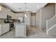 Modern kitchen with stainless steel appliances, granite countertops, and a center island at 8486 Insignia Ave # 101, Las Vegas, NV 89178