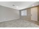 Inviting living room space with neutral color palette and tile flooring at 8486 Insignia Ave # 101, Las Vegas, NV 89178