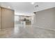 Open-concept living space with tile floors, neutral paint, and ample natural light at 8486 Insignia Ave # 101, Las Vegas, NV 89178